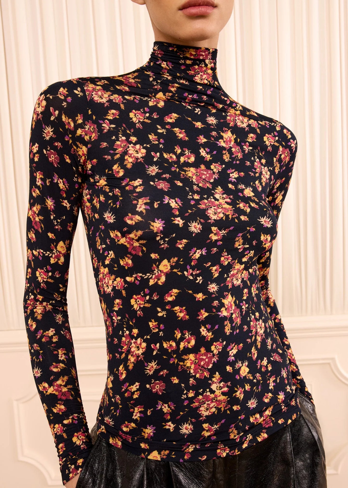 person wearing ulla johnson womens Aurelia Long Sleeve Jersey Top in Noir Floral