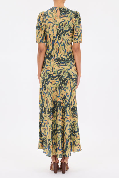 person wearing ulla johnson womens Samar Multicolored Puff Sleeve silk Midi Dress geode print