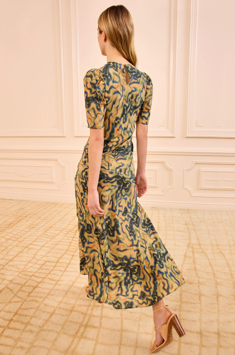 person wearing ulla johnson womens Samar Multicolored Puff Sleeve silk Midi Dress geode print