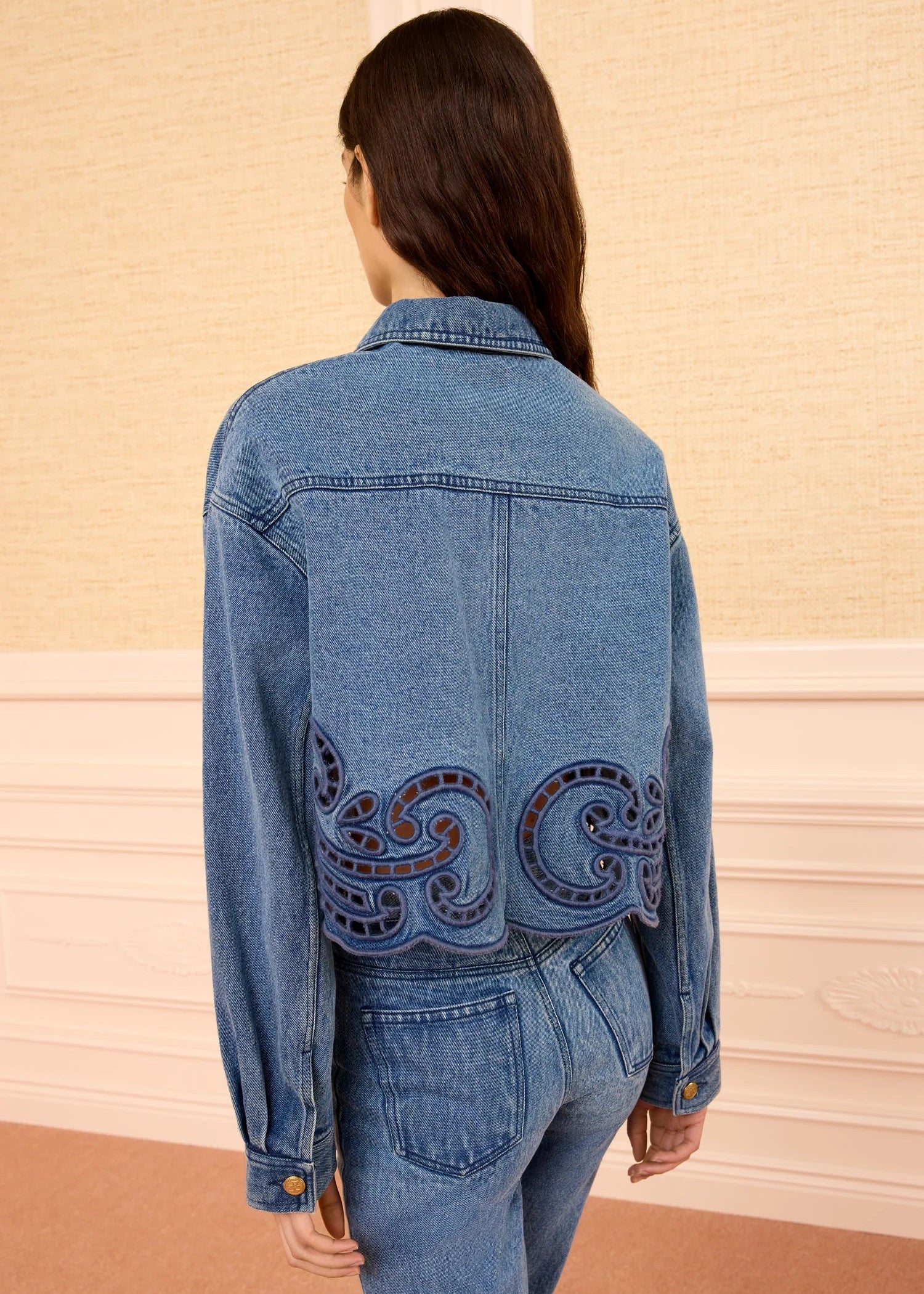 person wearing ulla johnson womens The Bobbi Jacket with Eyelet denim river wash