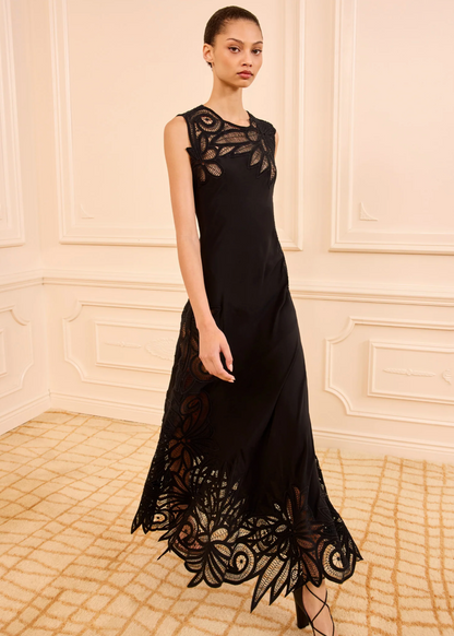 person wearing ulla johnson womens sleeveless silk Idra Lace Applique Dress in Noir black