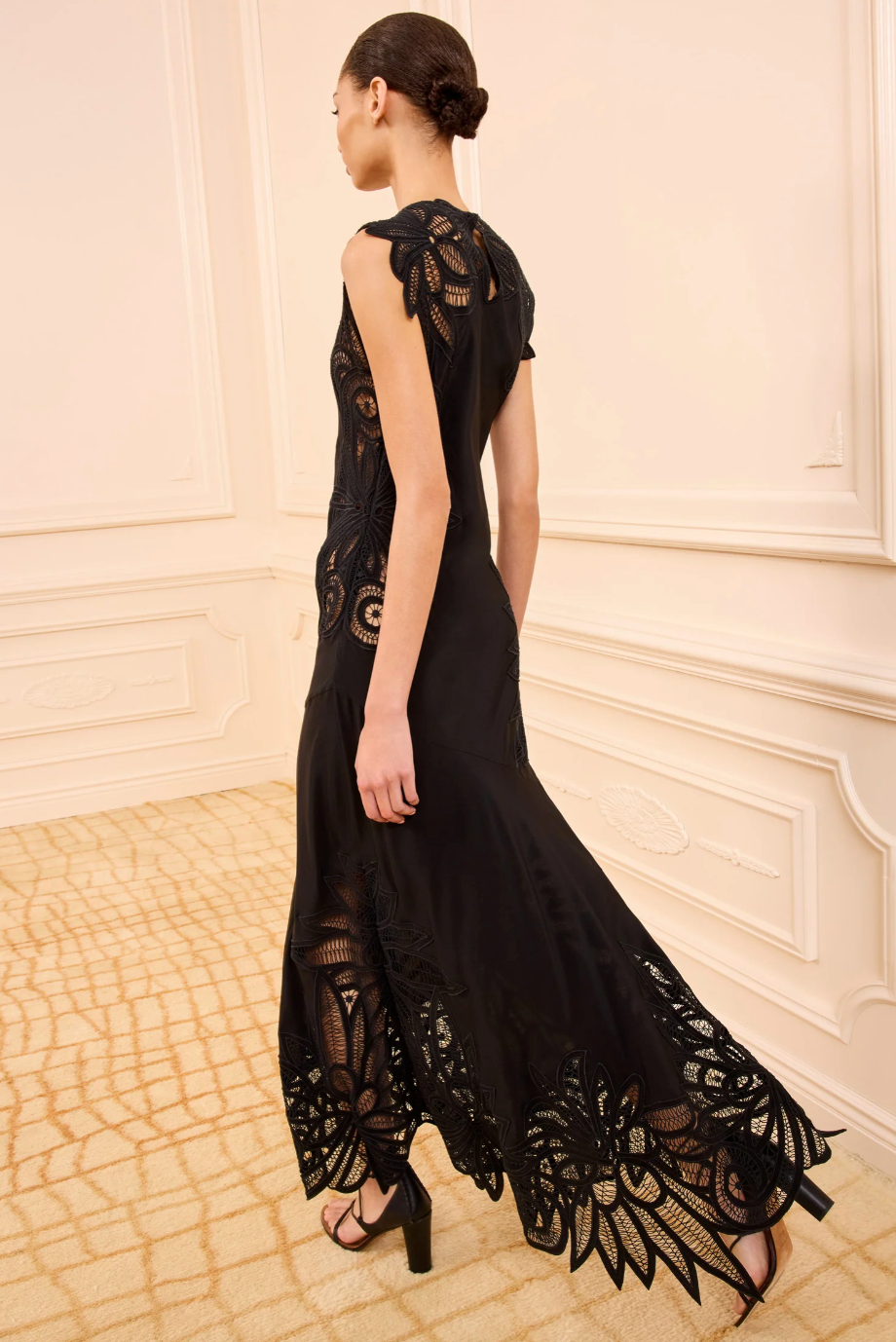person wearing ulla johnson womens sleeveless silk Idra Lace Applique Dress in Noir black