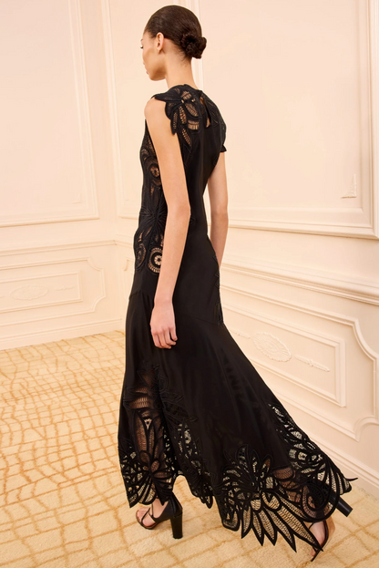 person wearing ulla johnson womens sleeveless silk Idra Lace Applique Dress in Noir black