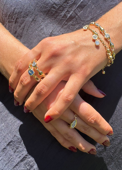 person wearing uniform object fine jewelry 18k yellow gold Supernova marquise cut round diamond asscher cut blue Sapphire Stacking Rings