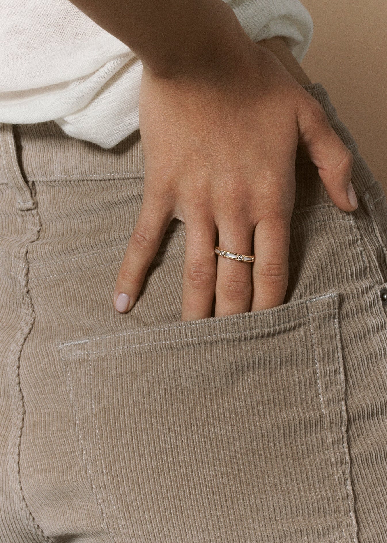 person wearing viltier fine jewelry 18k yellow gold Rayon Ring with Mother of Pearl and Diamonds