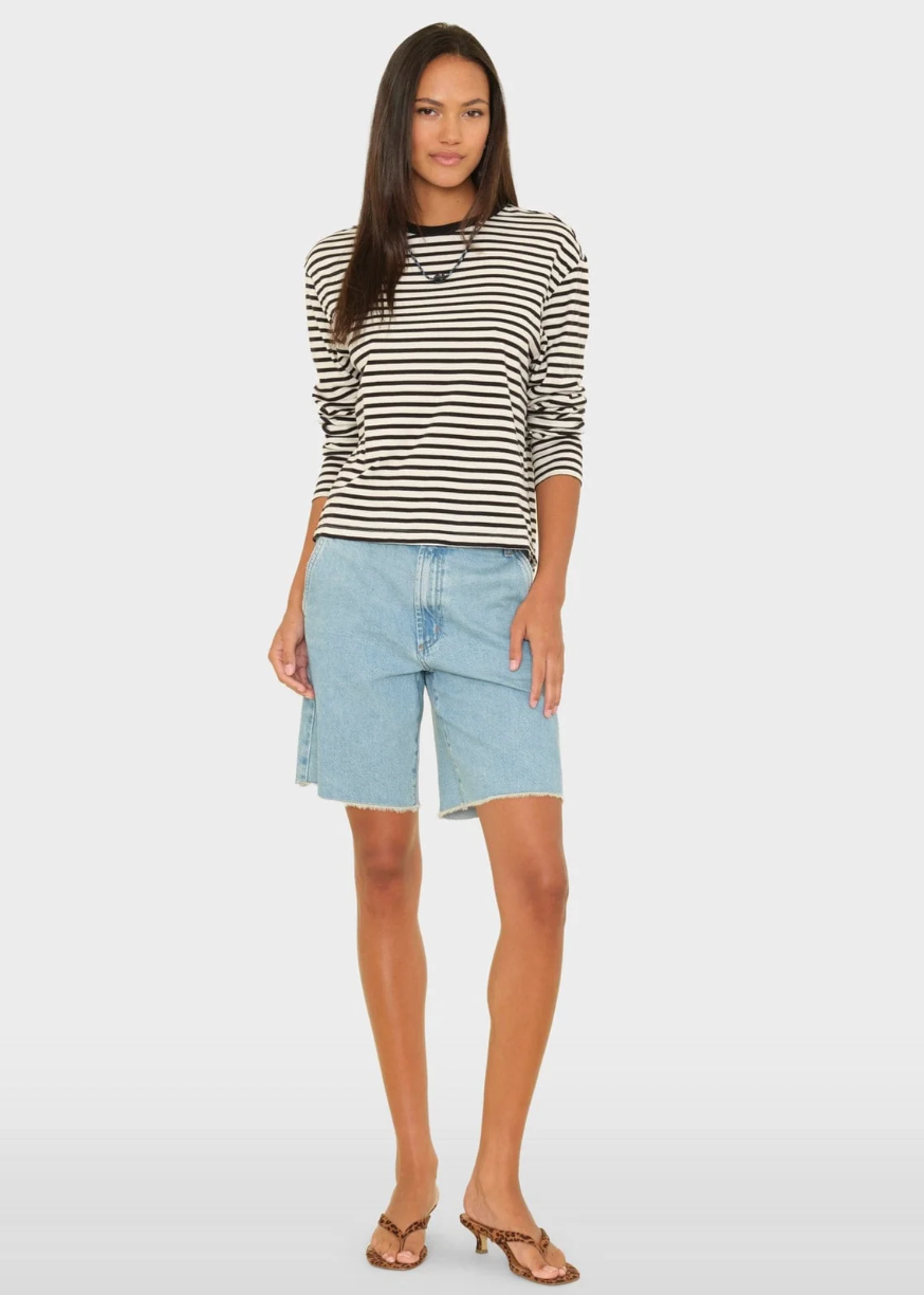person wearing xirena Knox Denim Short in Blue Cloud