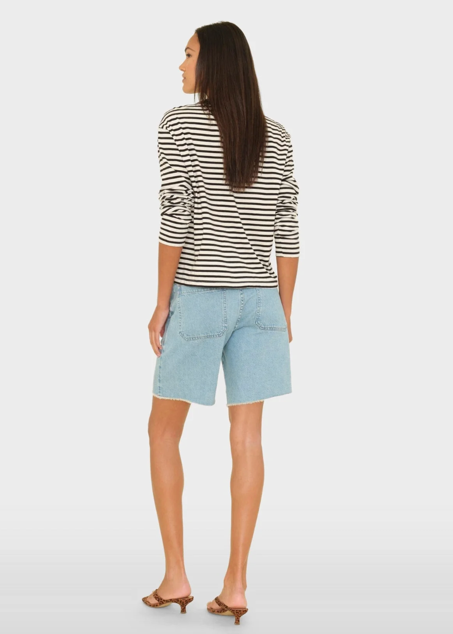 person wearing xirena Knox Denim Short in Blue Cloud
