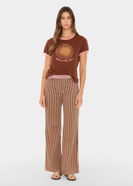 person wearing xirena Serra Pant in Canyon Rose Stripe