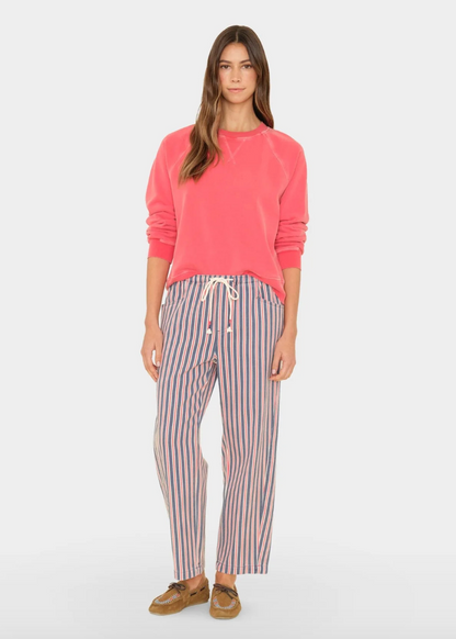 person wearing xirena denim Baxter Pant in regatta blue stripe