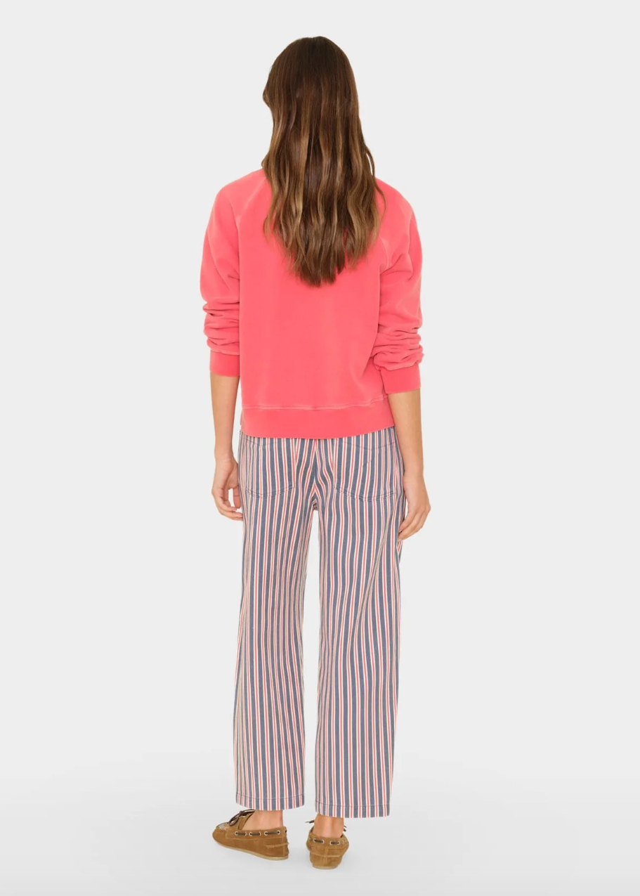 person wearing xirena denim Baxter Pant in regatta blue stripe