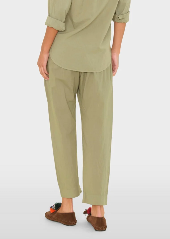 person wearing xirena womens Draper Pant in Dark Seagrass