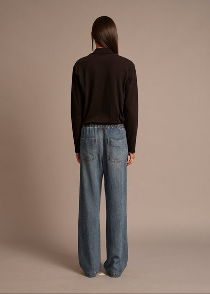 person wearing xirena womens Joey Denim Pant in Meridian Blue